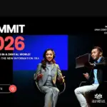 Two speakers sit onstage at a Summit event discussing local news in the digital era.