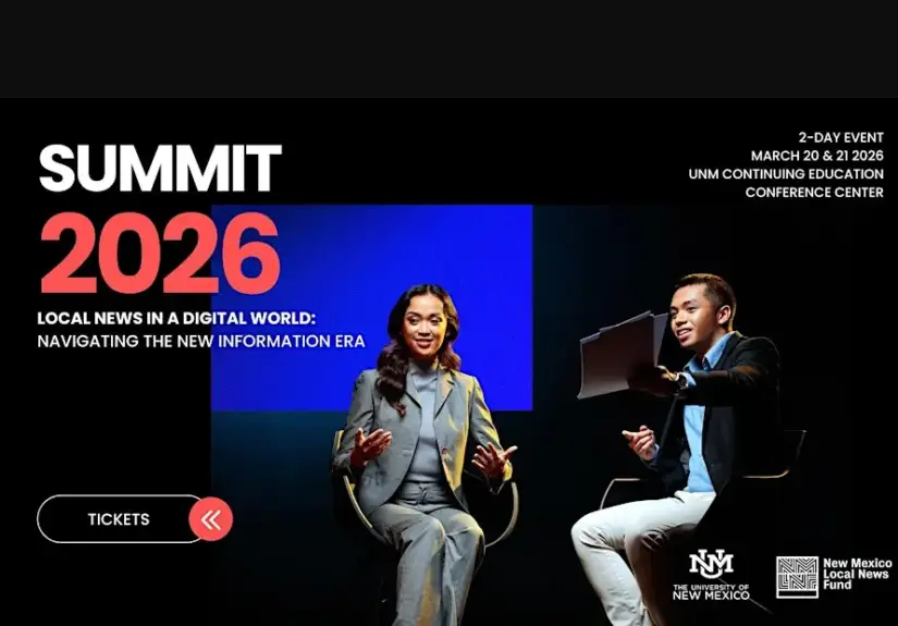 Two speakers sit onstage at a Summit event discussing local news in the digital era.